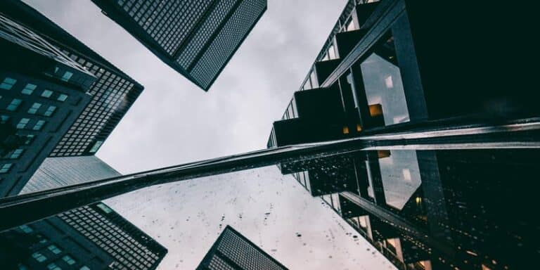 Looking ground up towards tall buildings