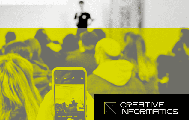 Image of someone in a crowd taking a photo of the speaker in front. Text reads: Creative Informatics