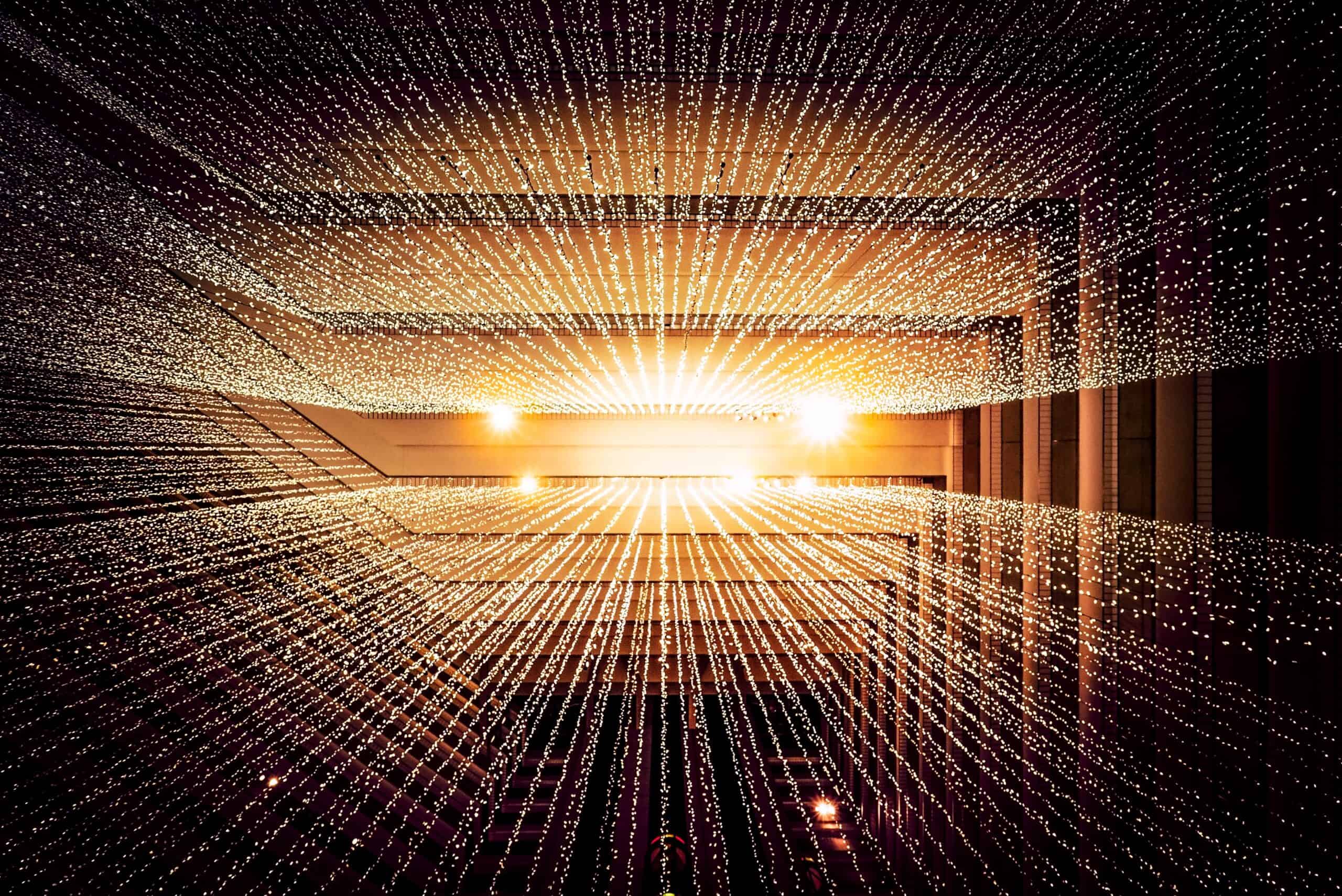 Gold geometric/architectural background with light splashes