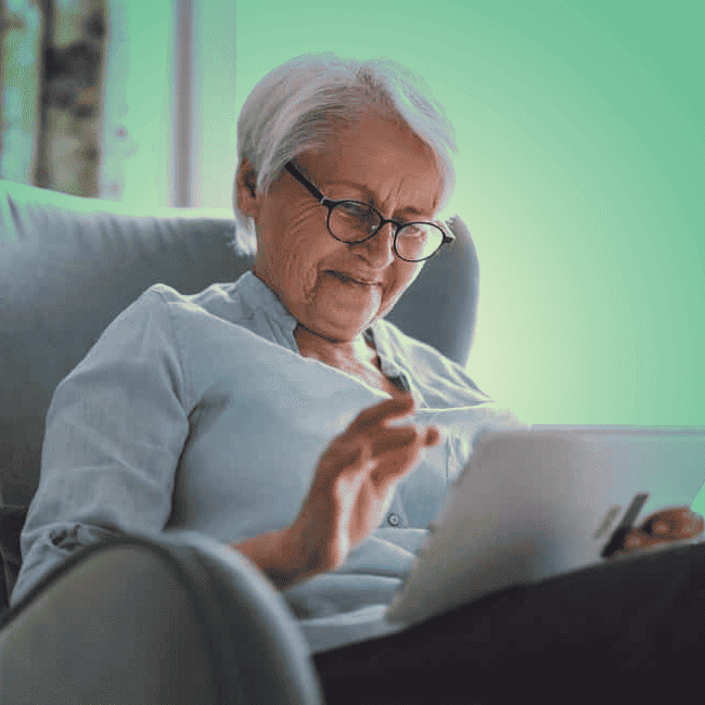 An older woman using a tablet