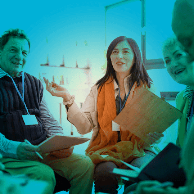 People sitting on seats in a circle in discussion