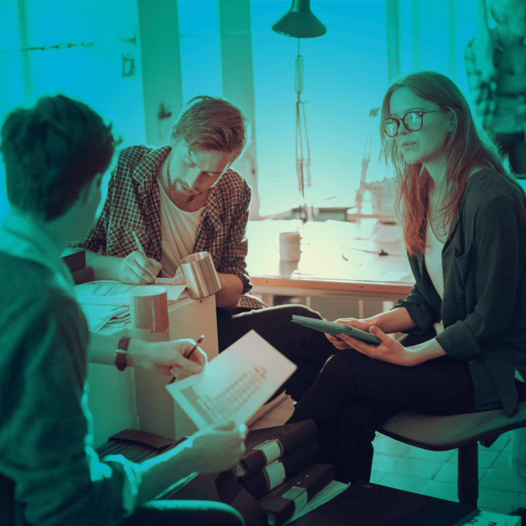 3 people sitting together in discussion