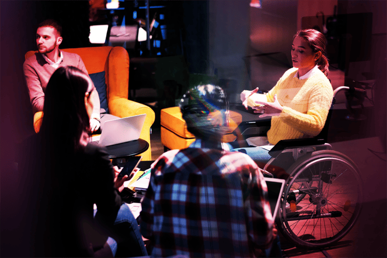 A disabled student talking to her peers, red tint over image.