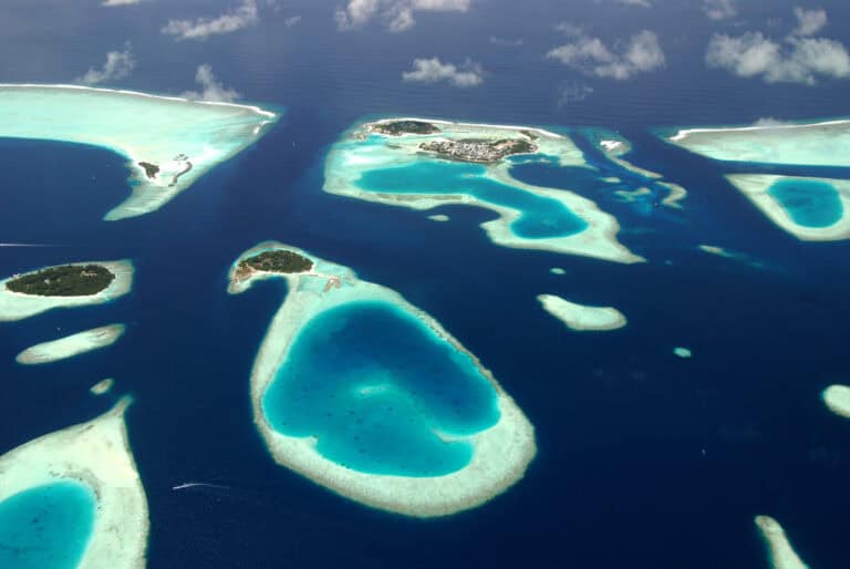 Panoramic view of Maldives islands from sea plane. Photography by Martin Kovalenkov