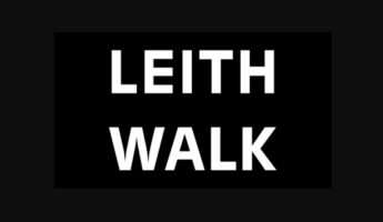 A black sign with the words "LEITH WALK" written in bold, white, uppercase letters.