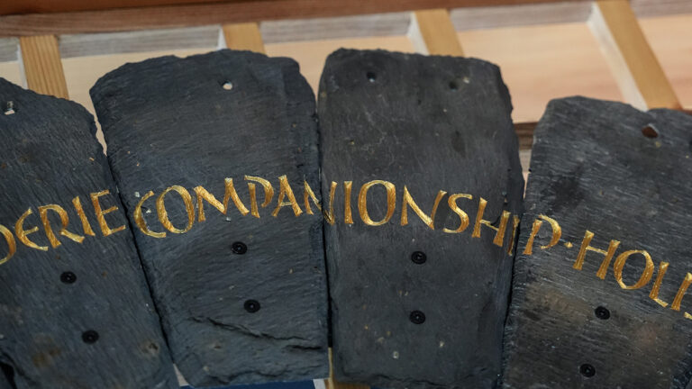 Slate from the Spirit Case sculpture displaying the words 'companionship'