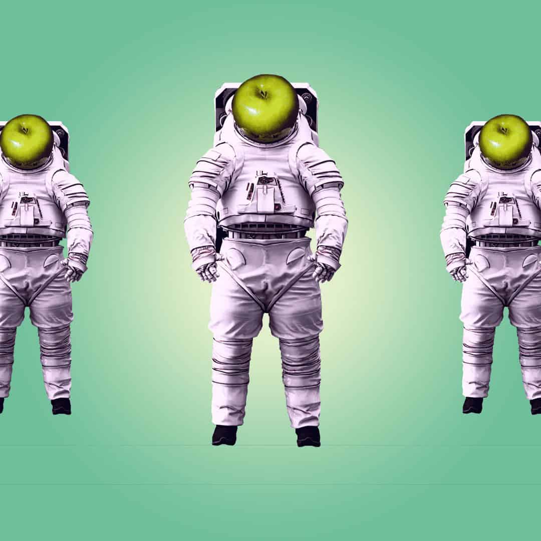 Astronauts with apple as head on mint gradient background