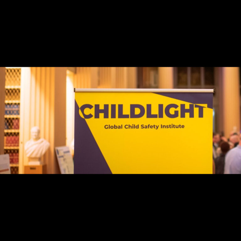 A yellow and blue banner reads "CHILDLIGHT Global Child Safety Institute" in bold letters. The background shows blurred bookshelves, a bust, and people in a well-lit indoor setting.